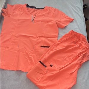 Lightly used pink/orange scrubs
